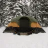 Family dome tent pitched in the snow among pines (illustrative photo)