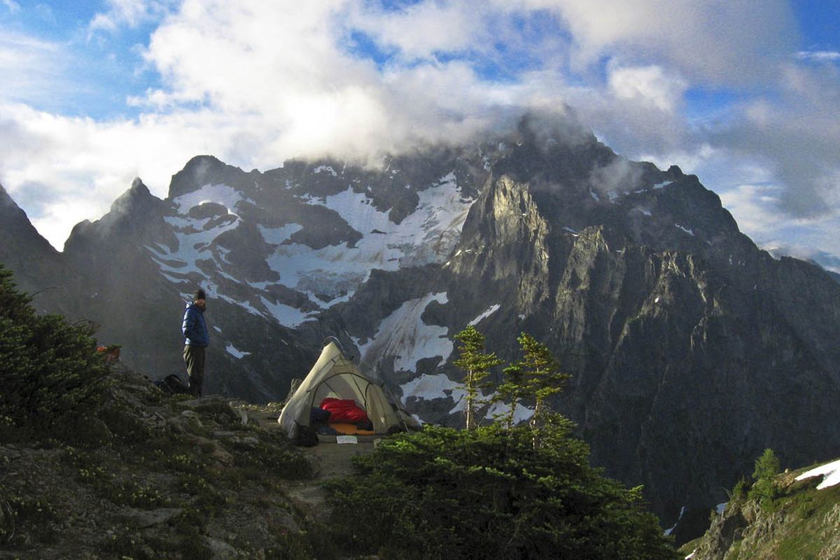Illustrative photo of a tent pitched in an alpine landscape